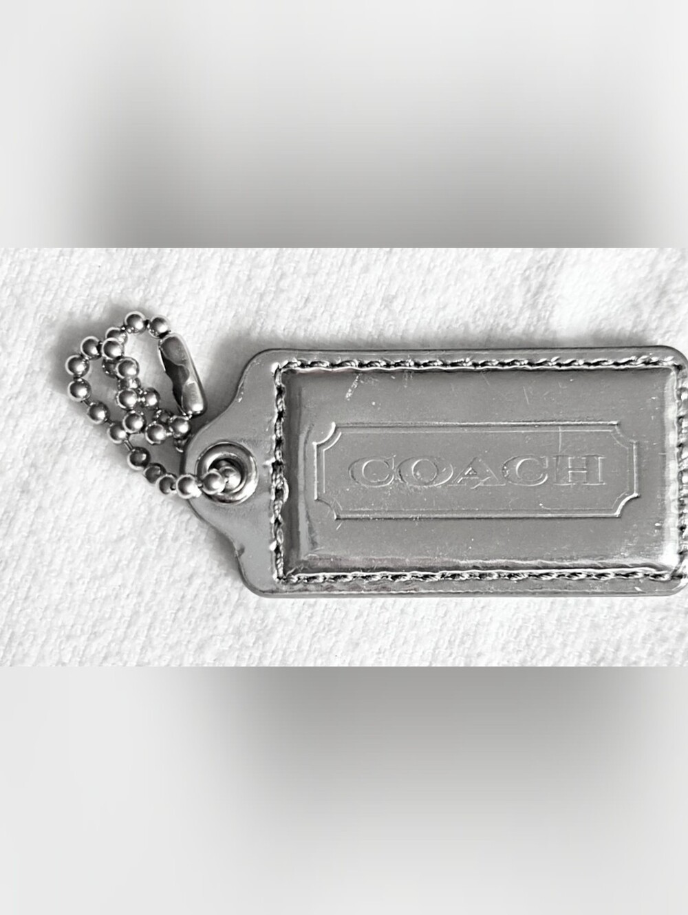 COACH shiny silver 2½" key fob hang tag single sided embossed